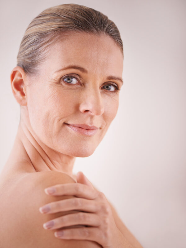 Beauty with age. Studio shot of a mature woman with beautiful sk Studio shot of a mature woman with beautiful skin.